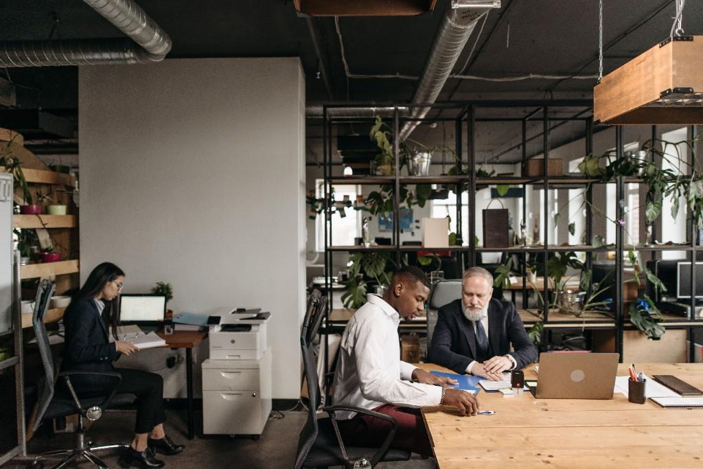 Business colleagues working together in a modern open office environment
